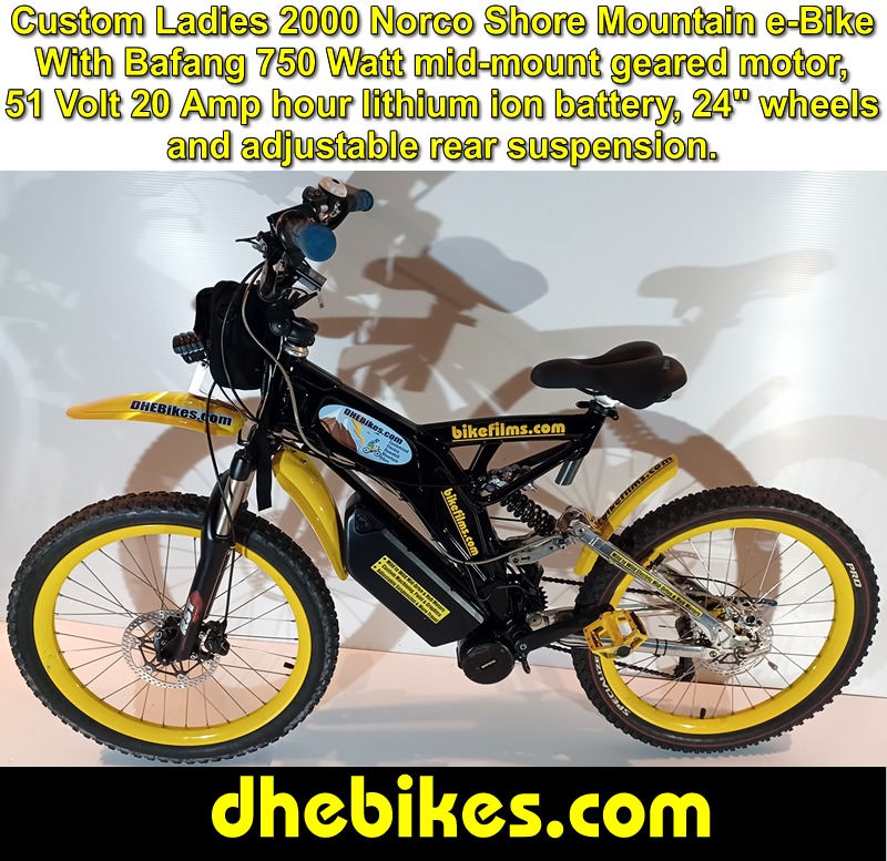 Custom made to order Womens electric downhill mountain bike by Pinnacle Innovations side view showing the Hope 2 piston downhill brakes, 24 inch wheelset and the Bafang 750 Watt mid mount electric motor kit with 20 Amp hour lithium ion 51 Volt battery.
