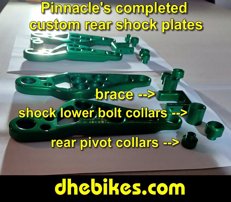 Pinnacle Innovations picture showing completed custom made and anodized suspension plates for two Norco custom downhill bike's long travel rear suspension linkage plates made from 6061 aircraft aluminum.
