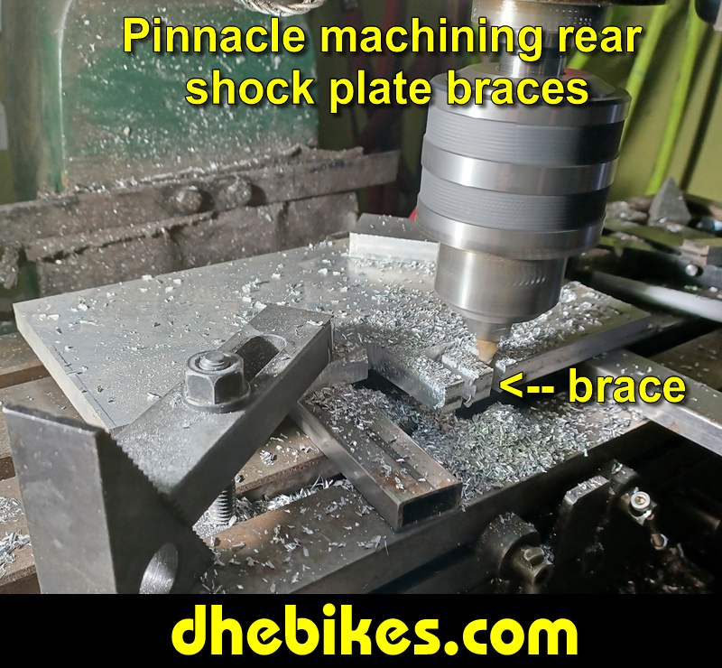 Pinnacle Innovations picture showing machining in progress of the rear shock braces for two Norco custom downhill bike's long travel rear suspension linkage plates made from 6061 aircraft aluminum.
